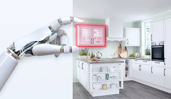 Une main robotique touche un placard mural à bord rouge dans une cuisine blanche de style campagnard qui est manifestement encore en cours de conception. Une main robotique touche un placard mural à bord rouge dans une cuisine blanche de style campagnard qui est manifestement encore en cours de conception.
